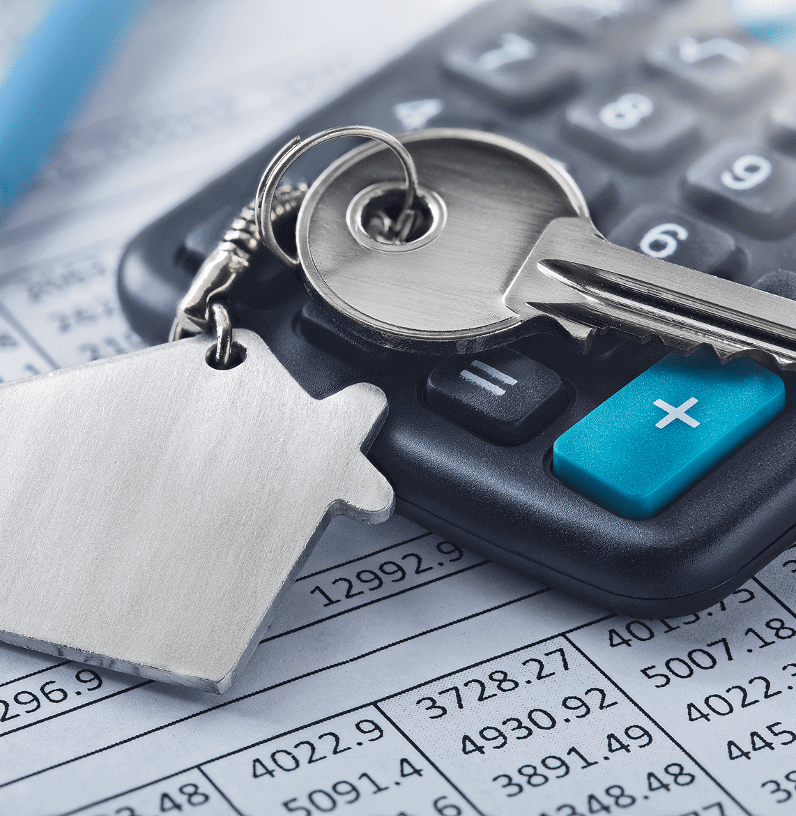 Keys and calculator on financial documents.