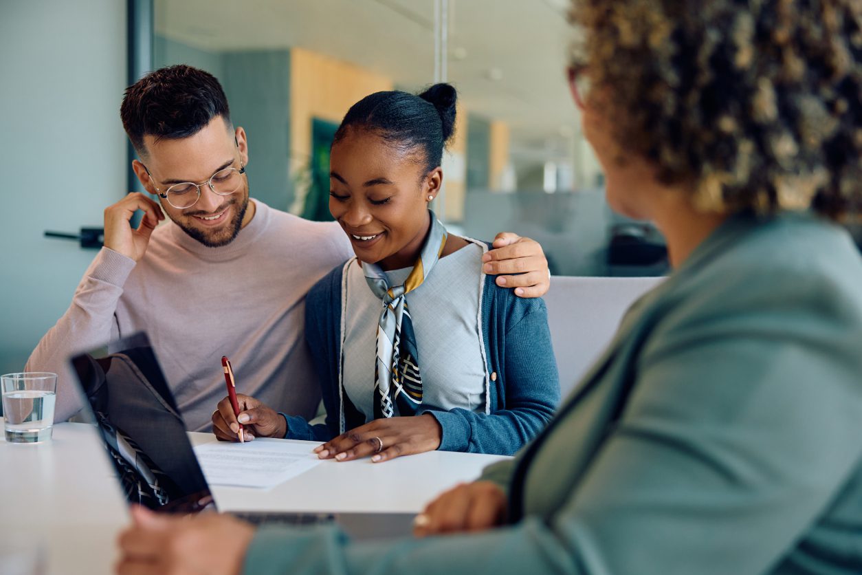 People smiling during a meeting in office.