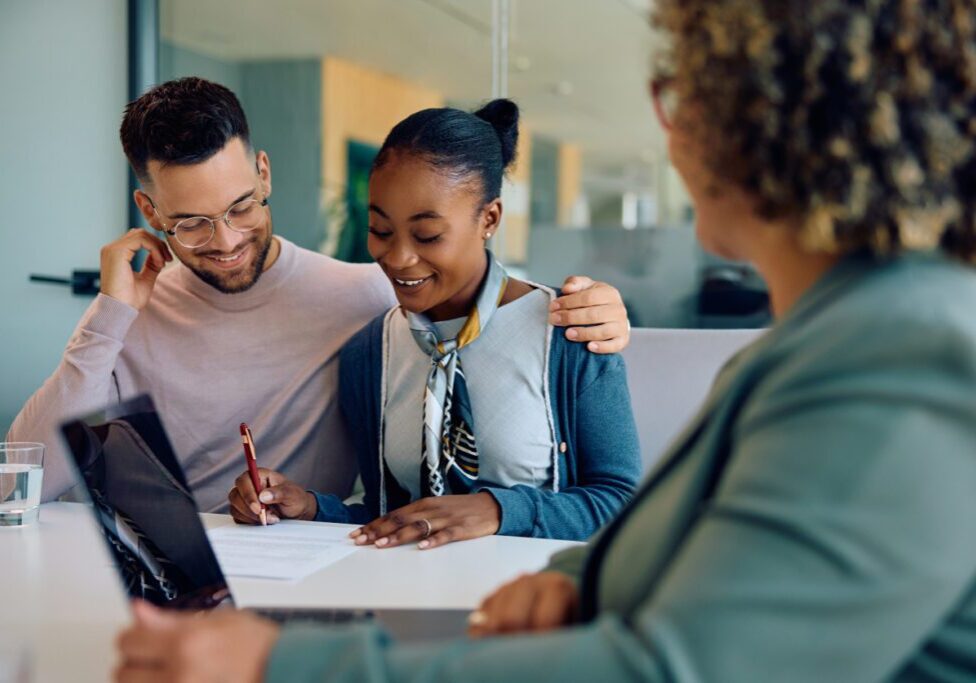 People smiling during a meeting in office.